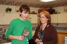 Student and Teacher Setting the Table